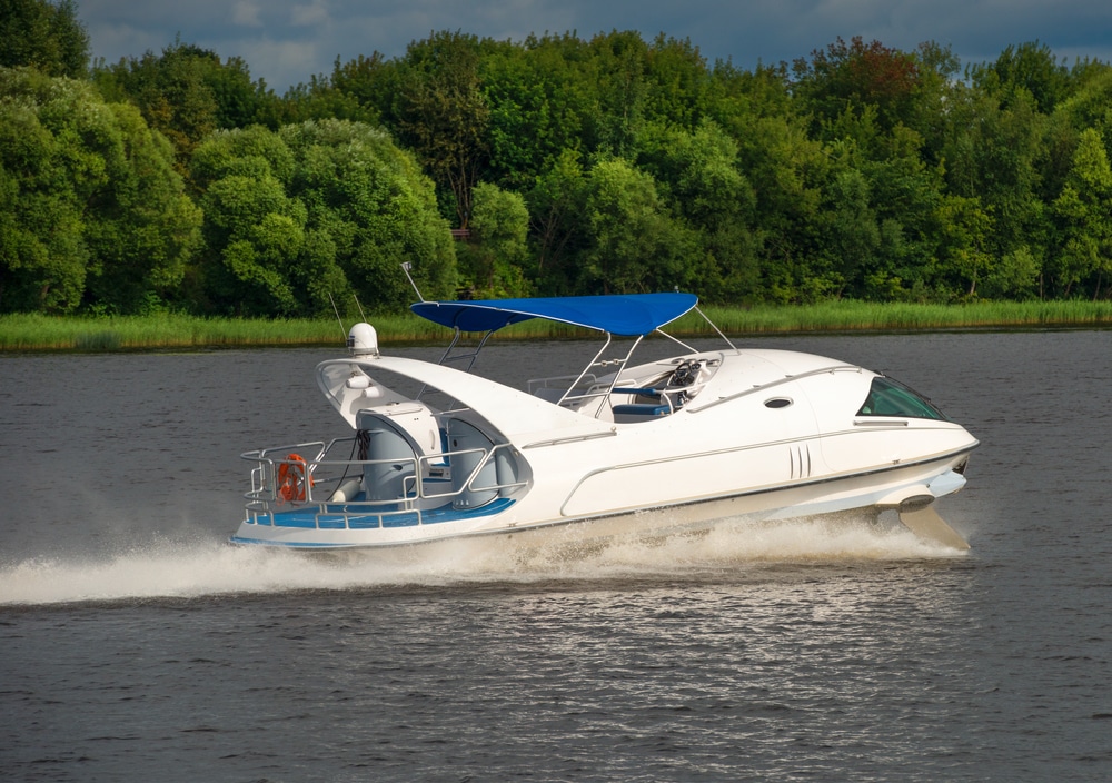 A Hydrofoil Boat Moves At High Speed Along The River