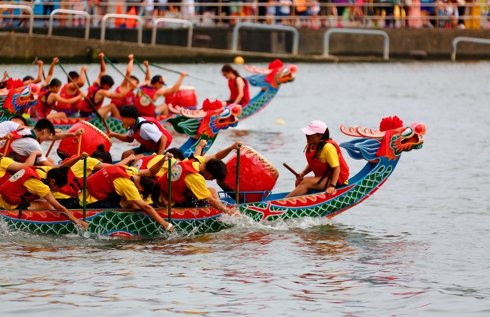 AA view of people sitting inside dragon boat