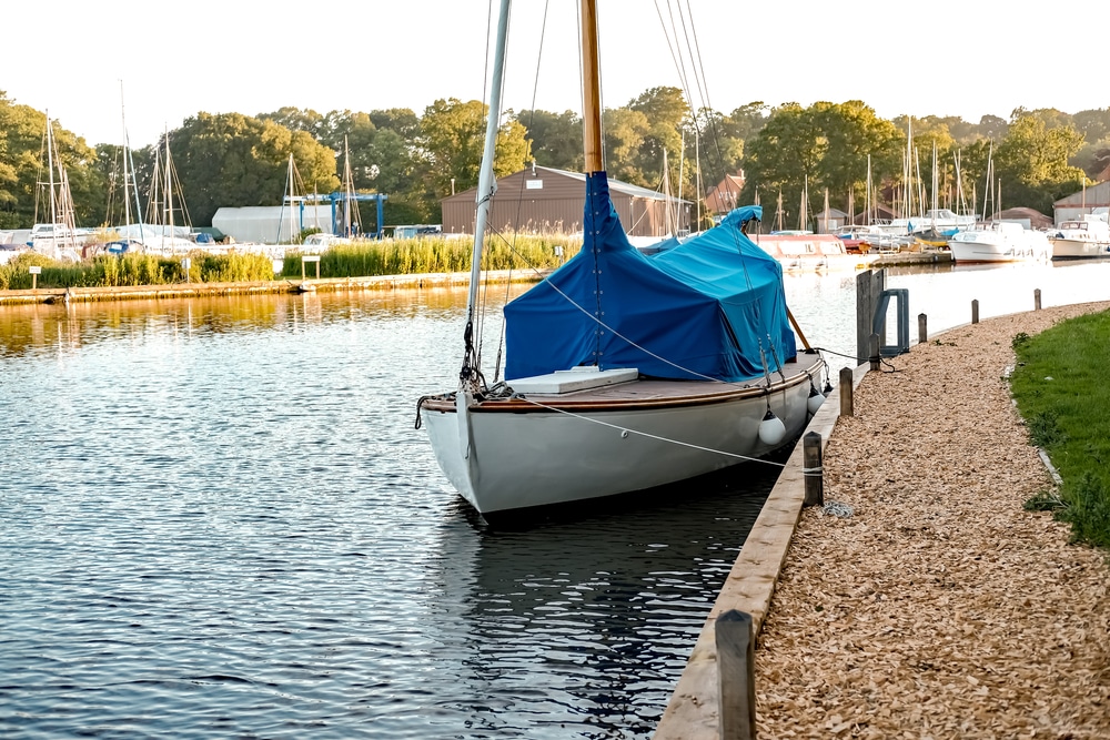 Traditional Sailing Boat Moored In An Empty Public Mooring On River