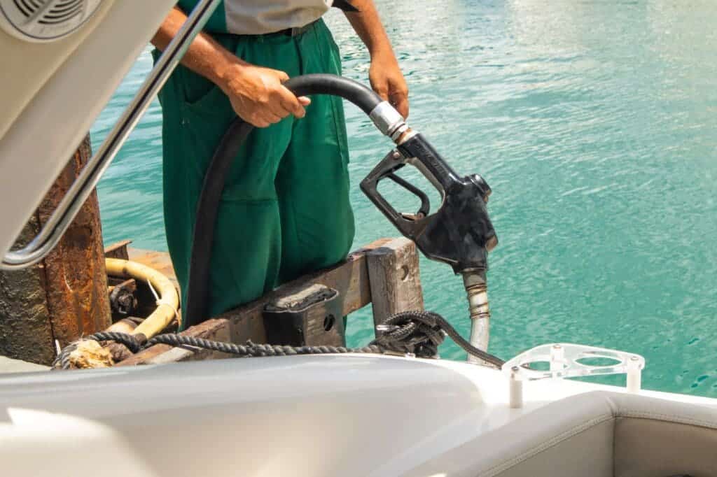 a man fueling the boat