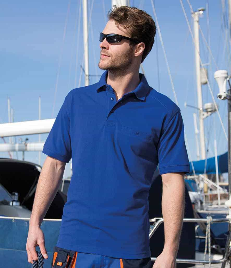 a man wearing a blue polo shirt