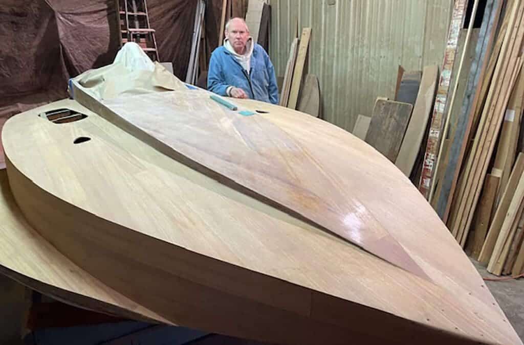 Bruce Bronson works to restore a hydroplane from the s