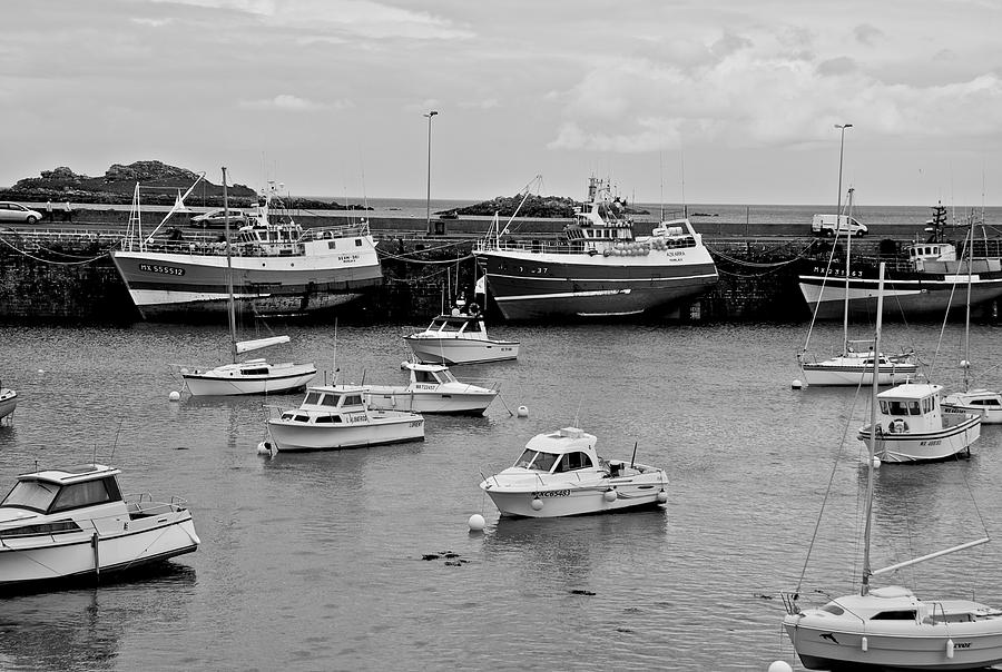 life boats along with the ships on the side of the port