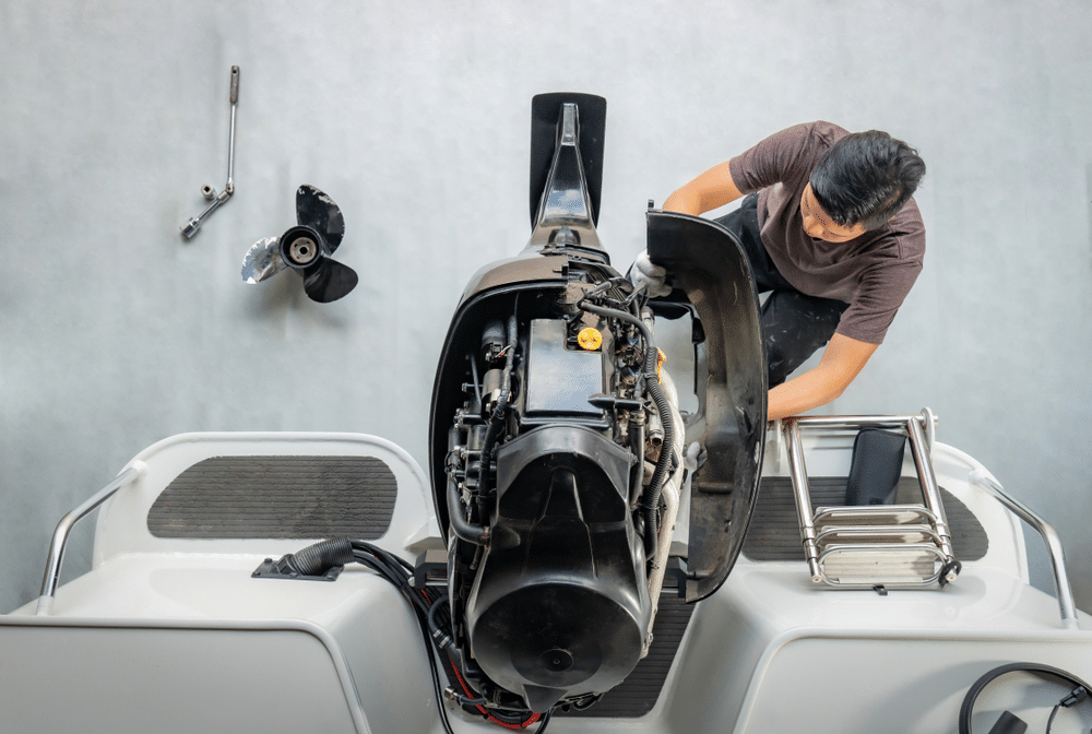 A view of a person dealing with an aluminum boat