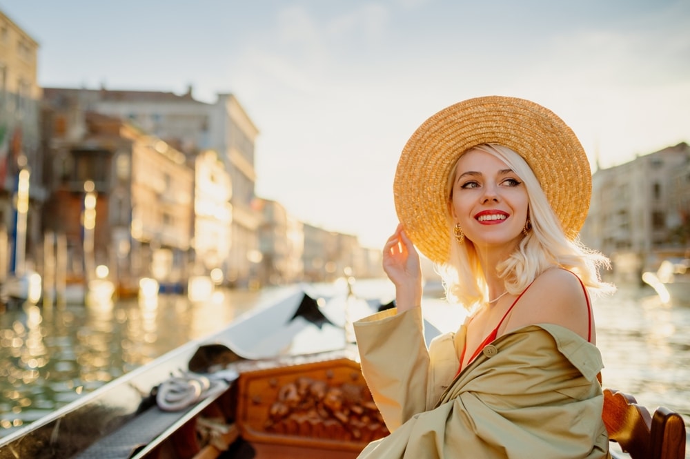 Happy Smiling Elegant Woman Wearing Straw Hat On Gondola Ride