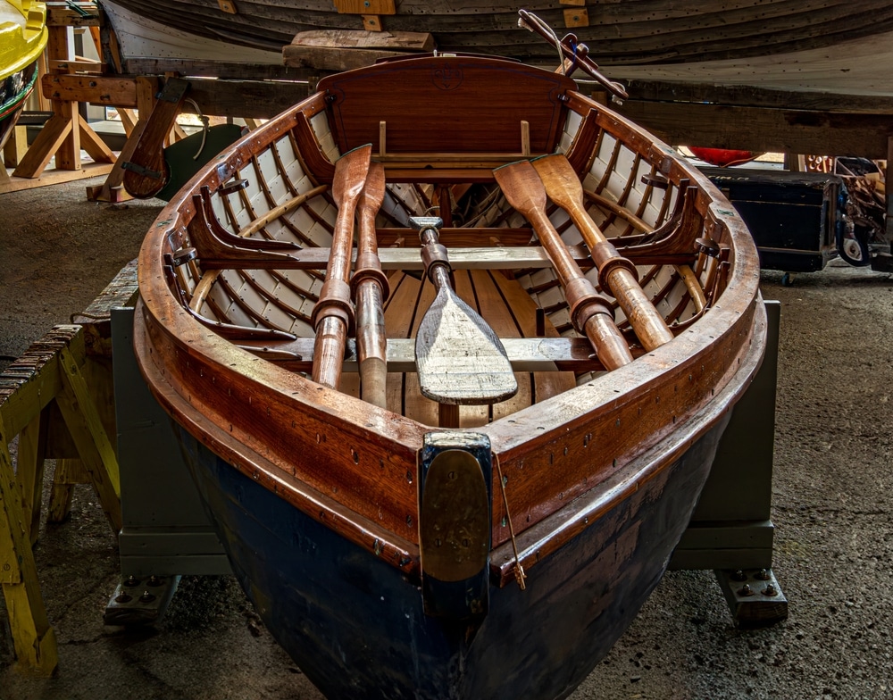 Lovely Wooden Row Boat In Workshop