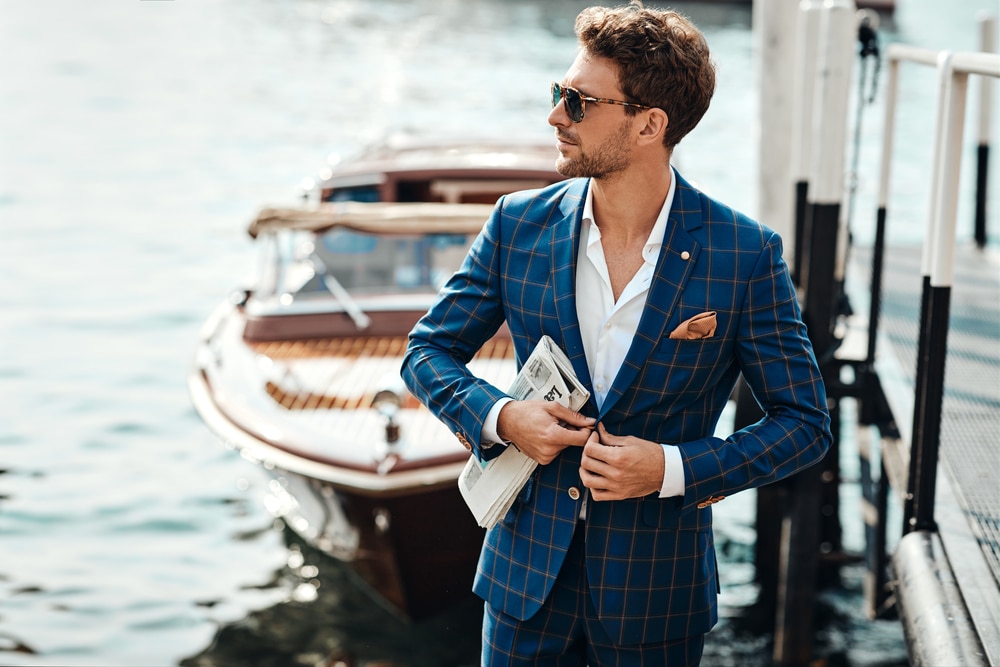 Young Handsome Man In Classic Suit Over The Blurred Lake