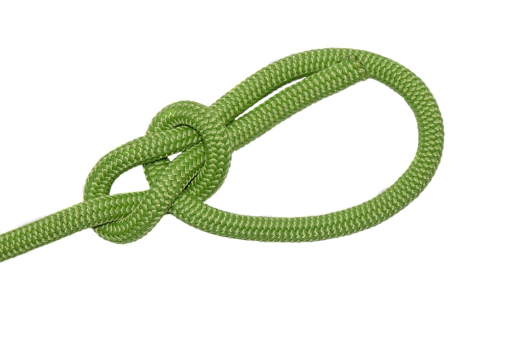 bowline, a knot of green rope, isolated on white background