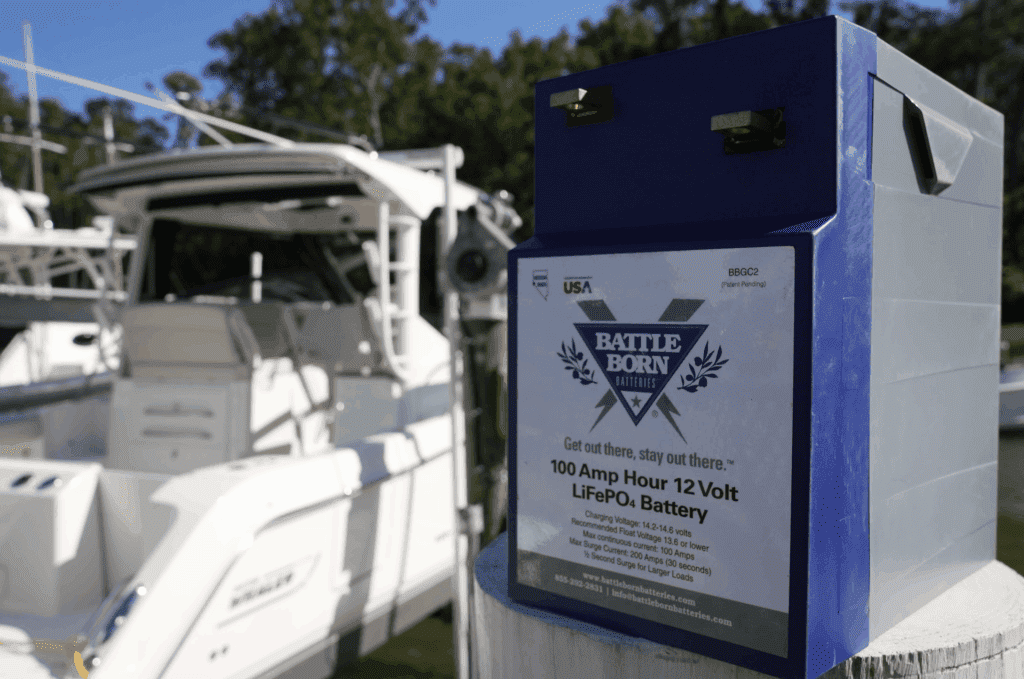 A close view of boat battery beside a white boat