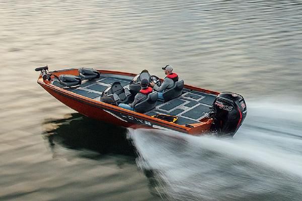 A view of a bass boat splashing water behind while moving with two people in it