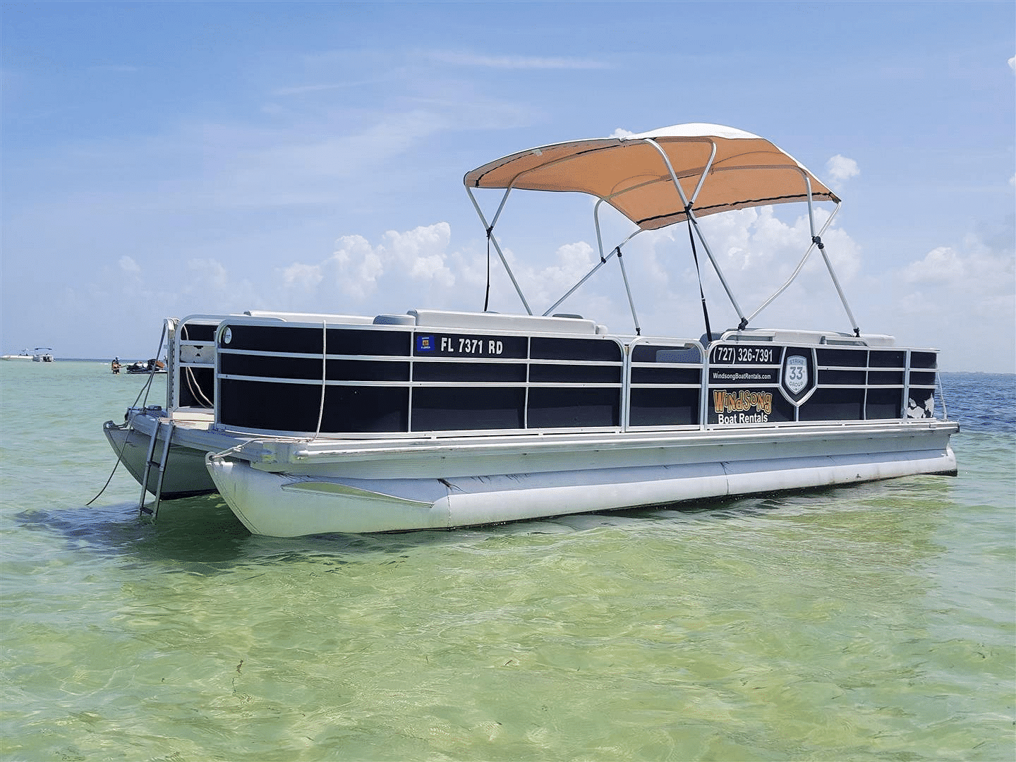 A view of a pontoon boat in sea