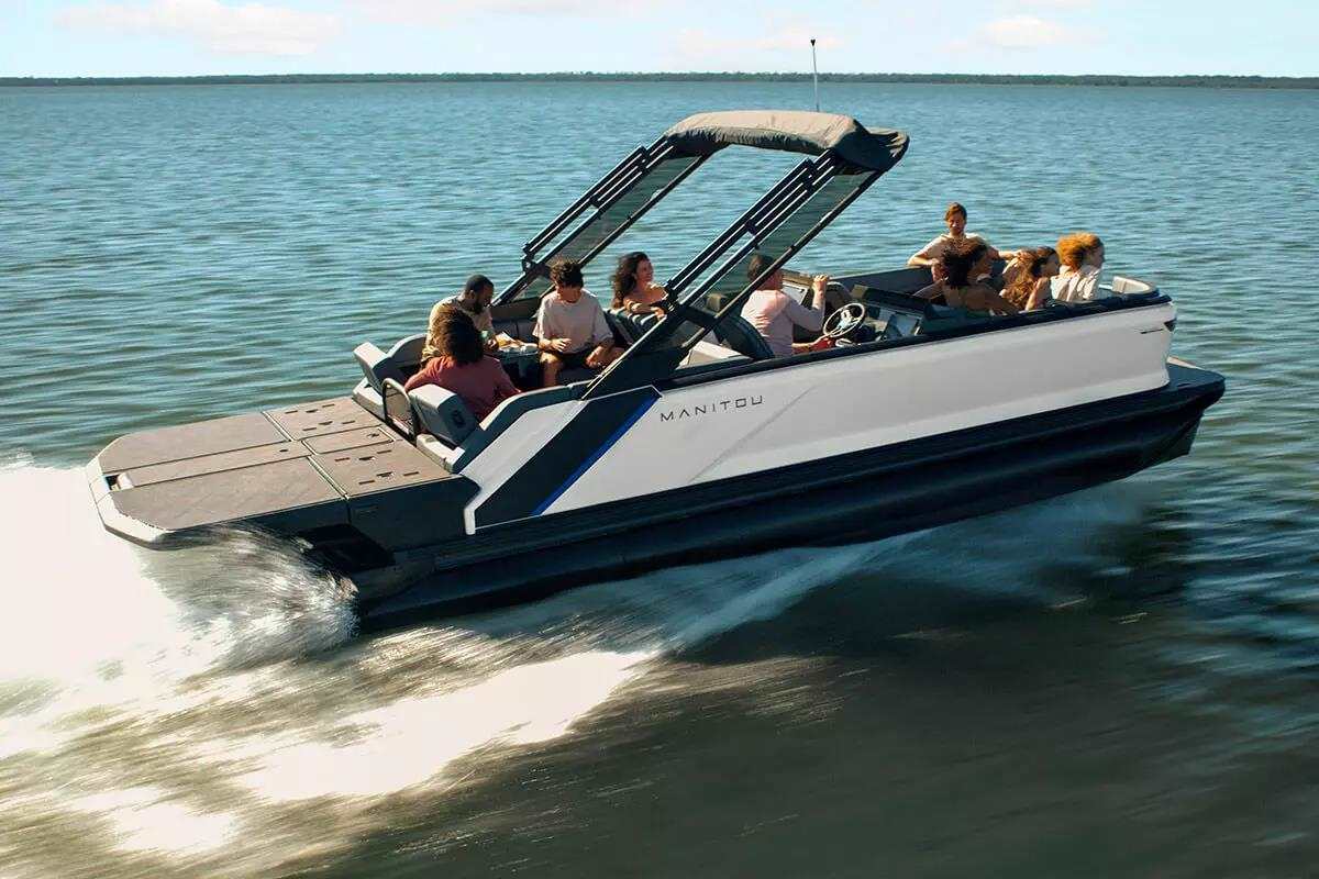 A view of a pontoon boat sailing in sea with people on it