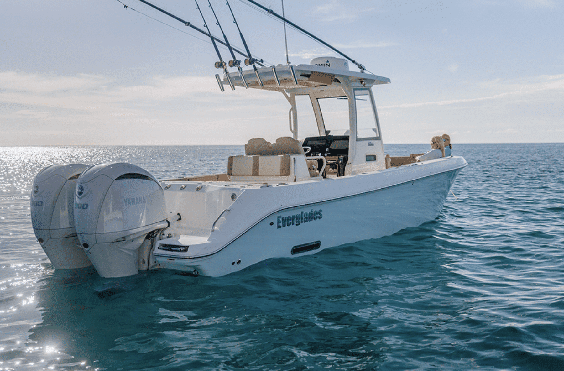 A view of a white centre console boat in blue sea