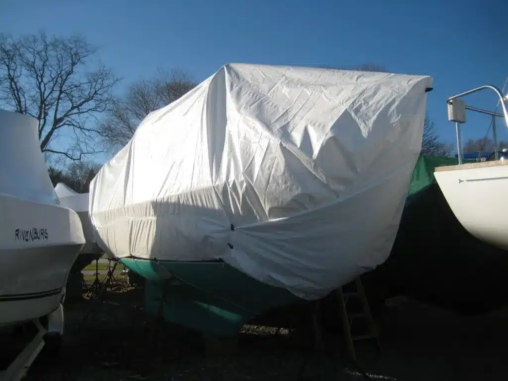 A view of a white diy boat cover on a boat