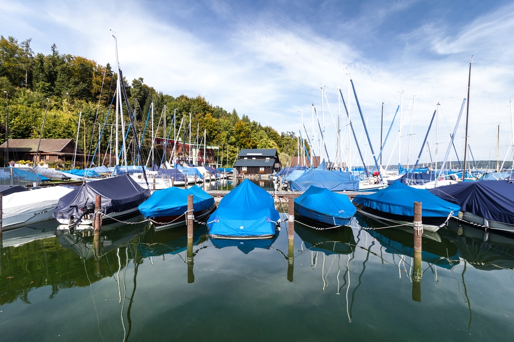 A view of boat with covers on them