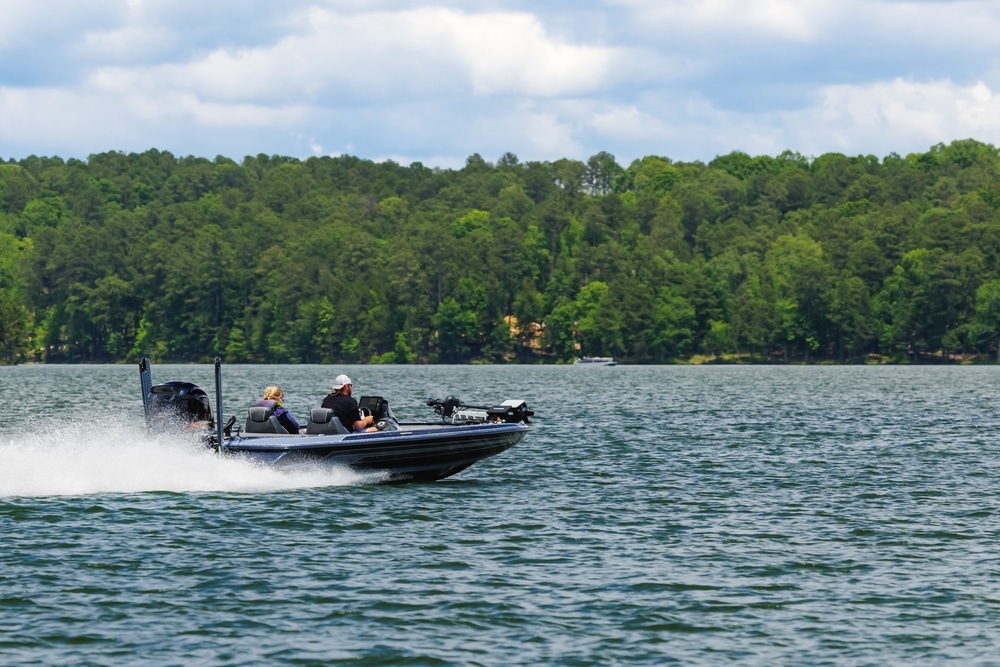 A view of people driving a bass boat in the sea