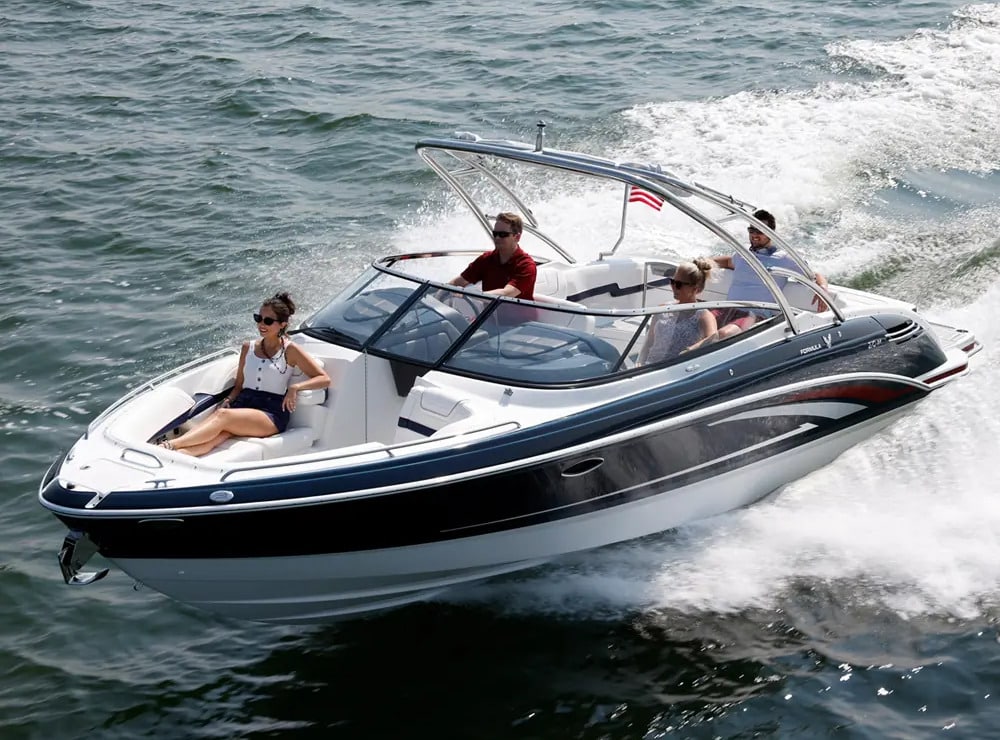 A view of people sitting in a bowrider boat in sea