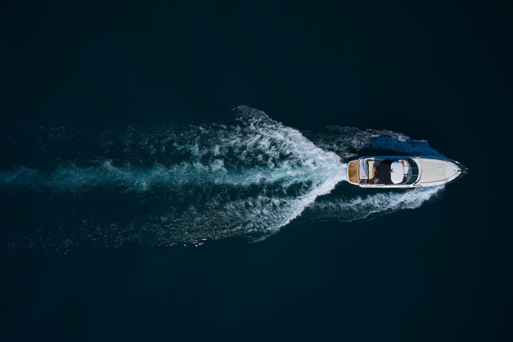 An overhead view of a boat sailing in sea