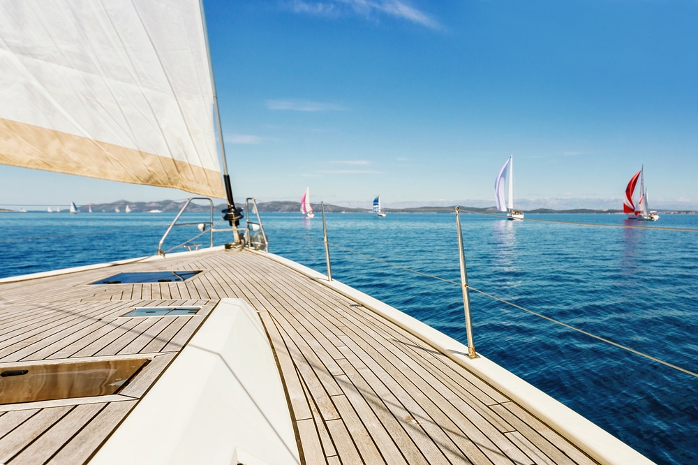 A close view of a deck boat on a lake