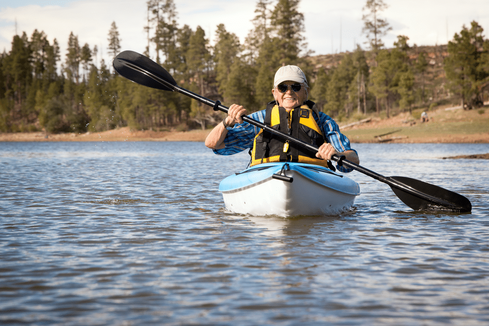 A view of a man boating in a lake