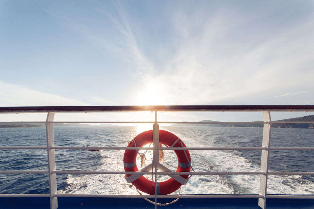 A view of sea with a life jacket on a boat